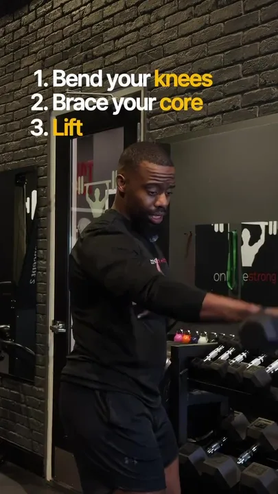 Daniel demonstrating a dumbbell front raise