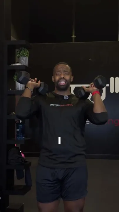 Daniel demonstrating an overhead press